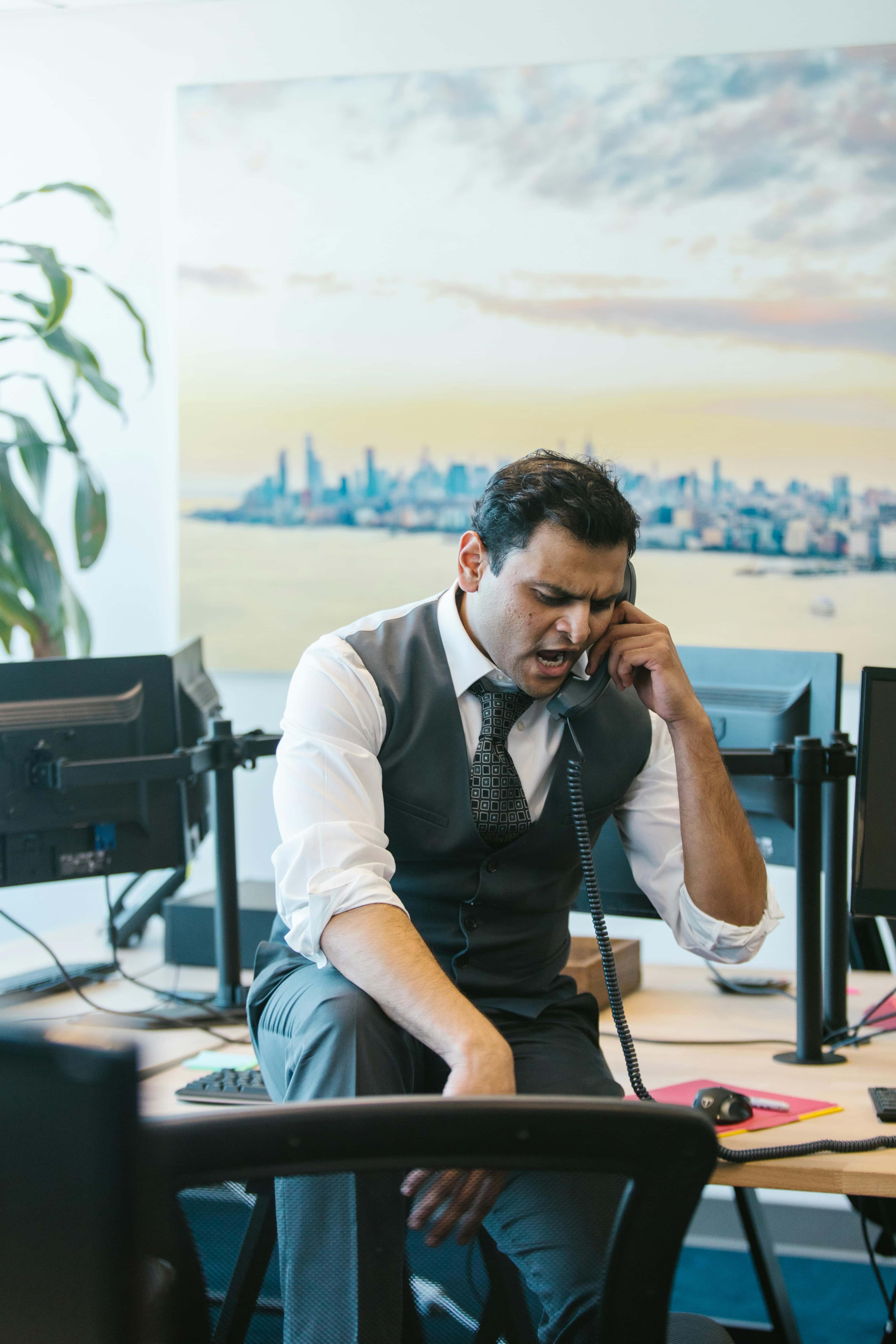 Stressed manager on the phone during an after-hours issue