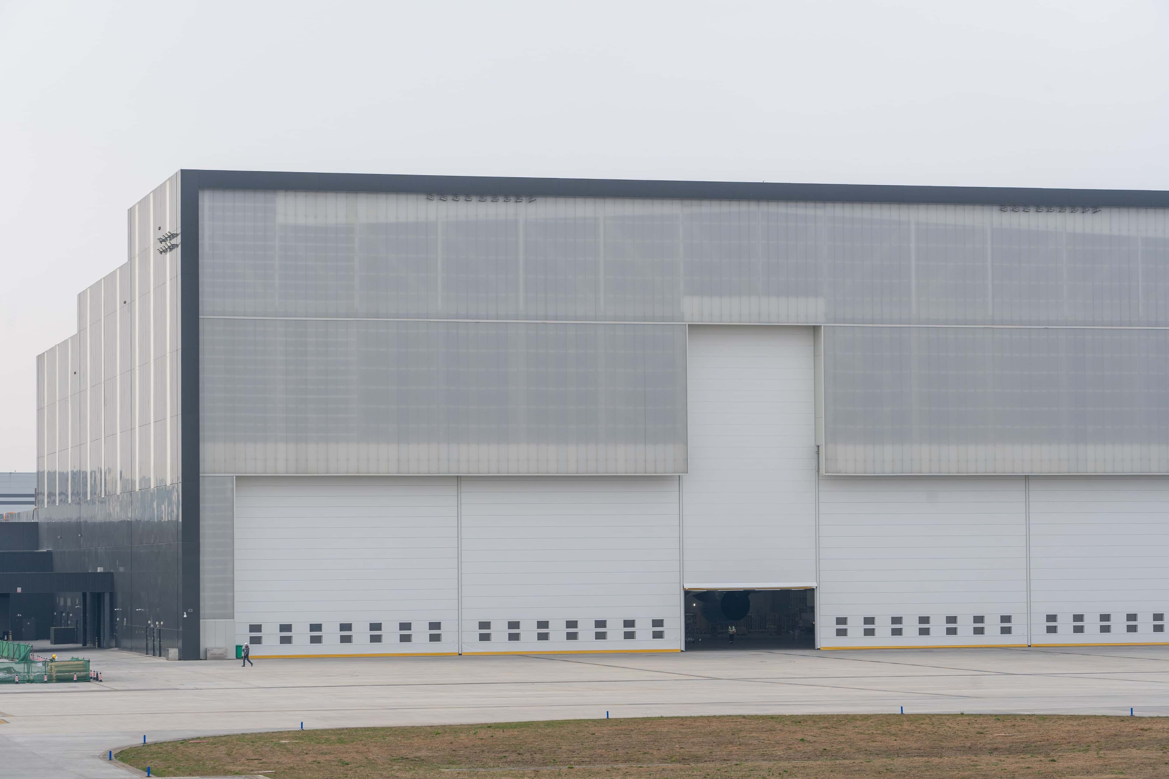 Modern industrial warehouse exterior representing Power Inn