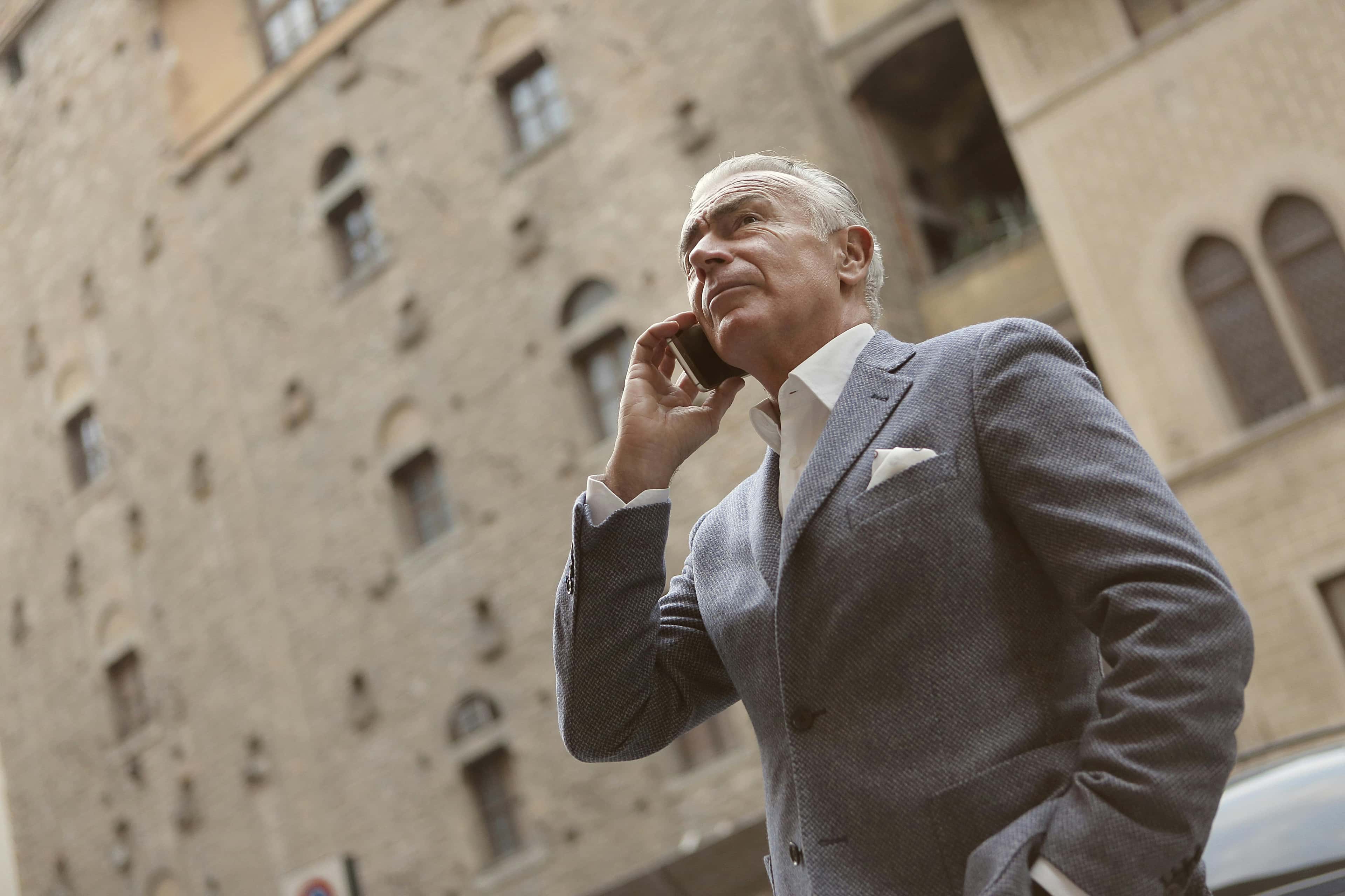 On-call professional using a smartphone for urgent inbound calls