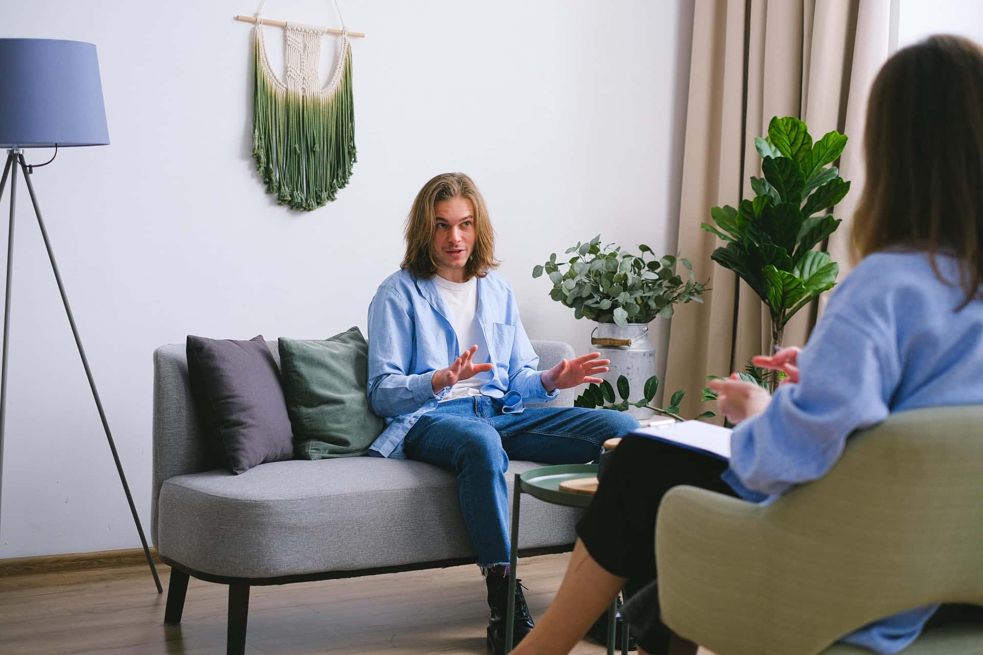 Person talking through a support issue with a counselor