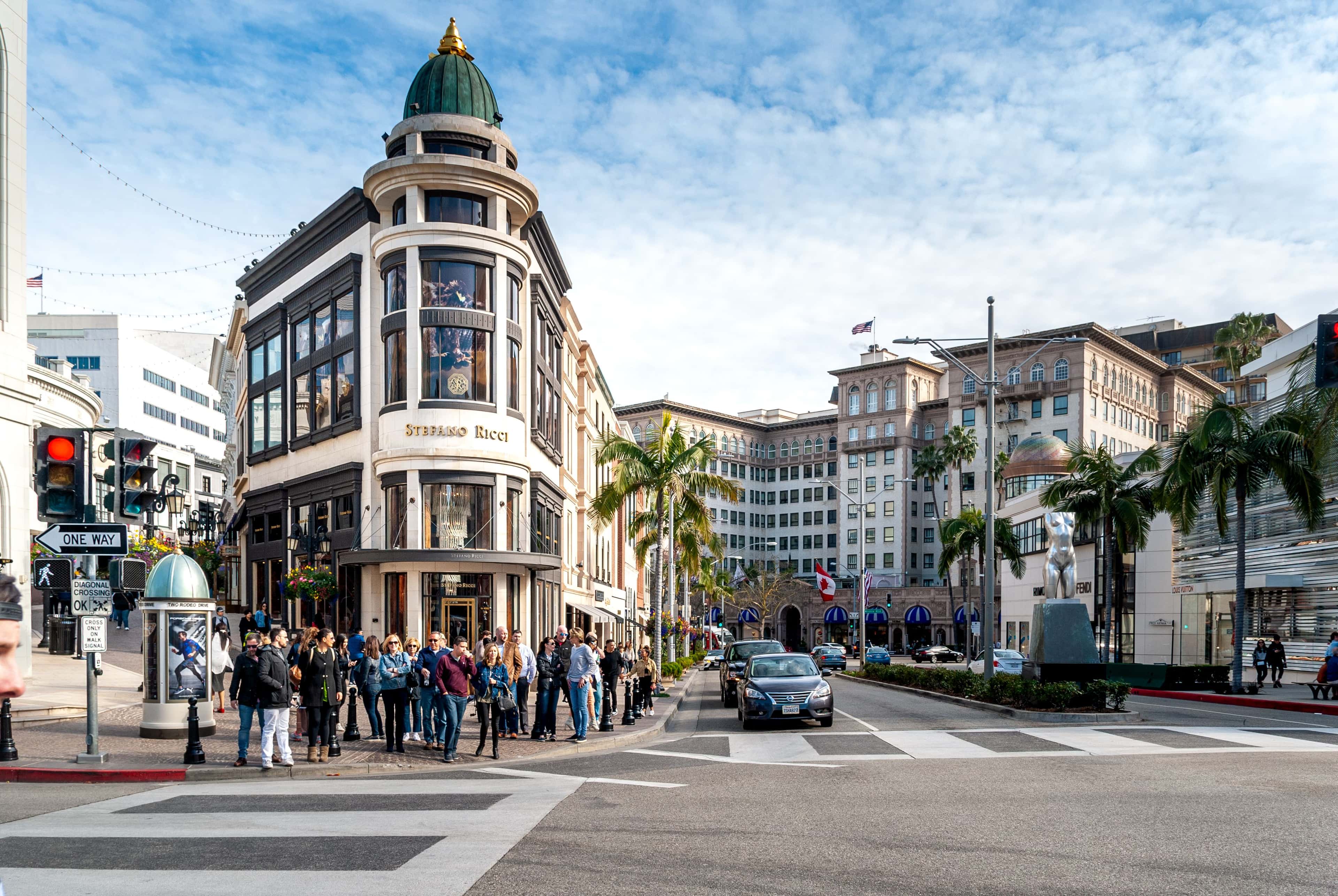 Street scene in Beverly Hills with iconic buildings and pedestrian areas