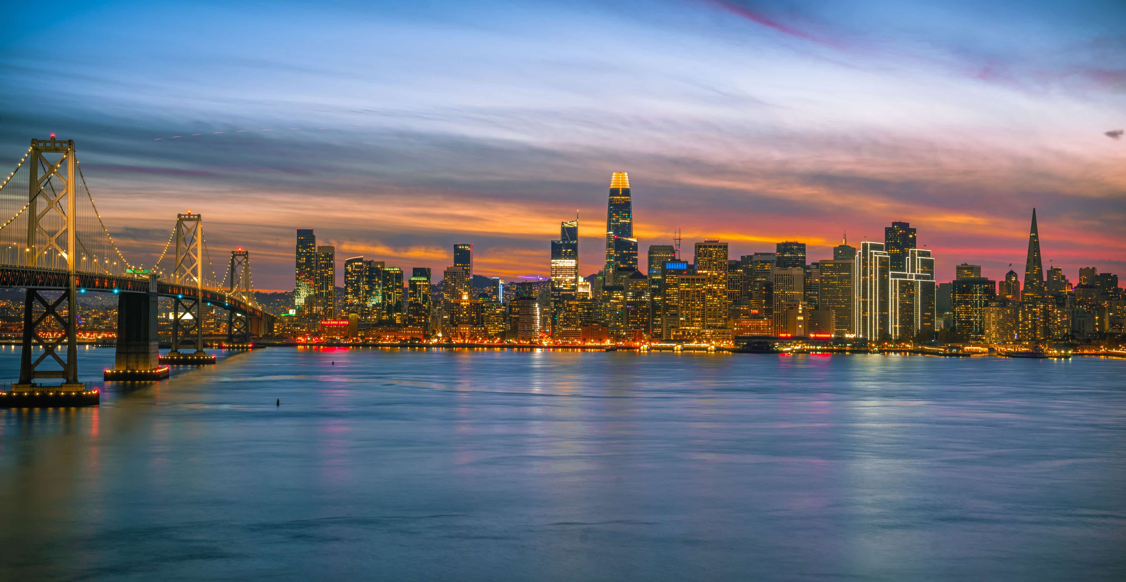 San Francisco skyline at twilight over the Bay Bridge