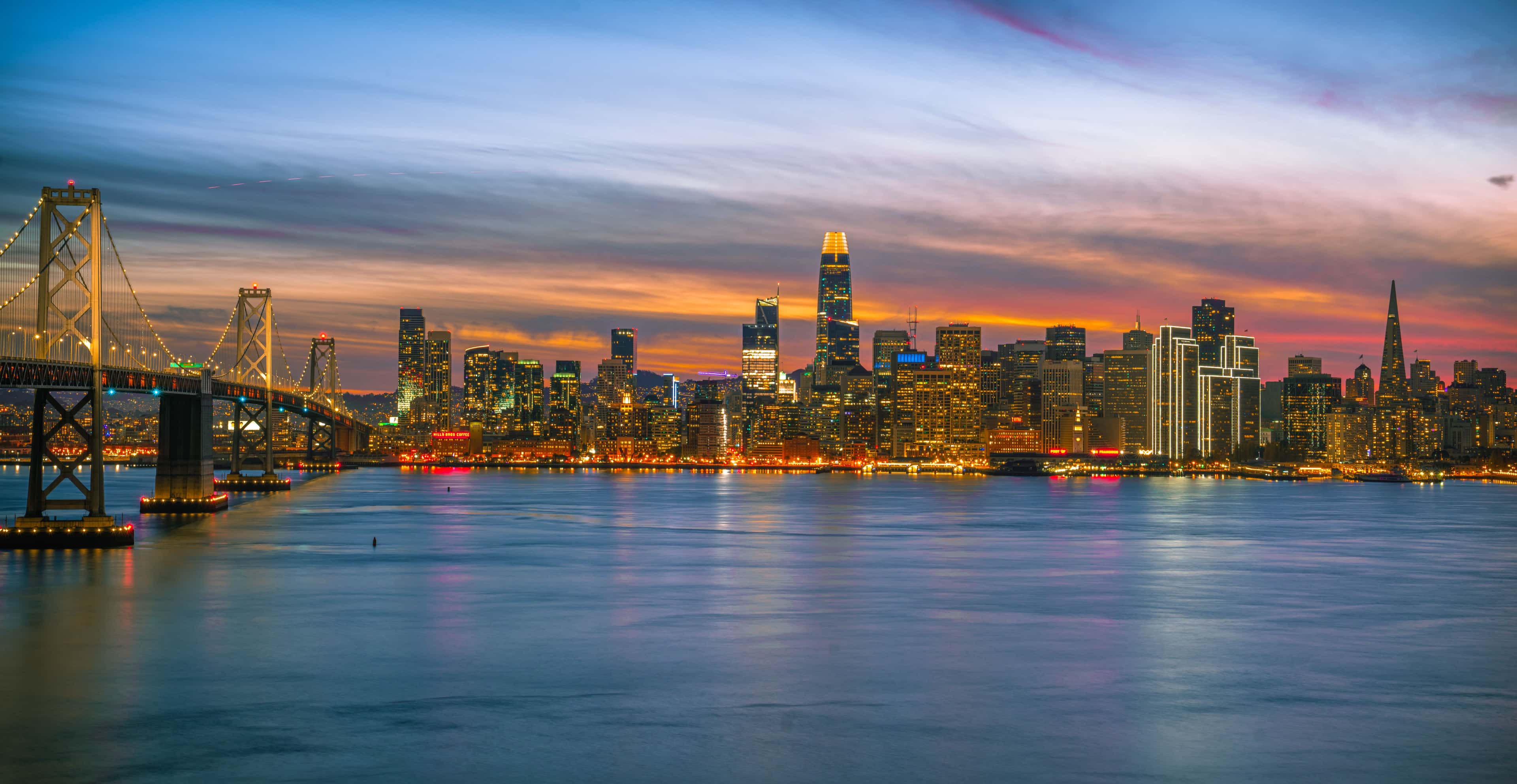 San Francisco skyline at twilight over the Bay Bridge