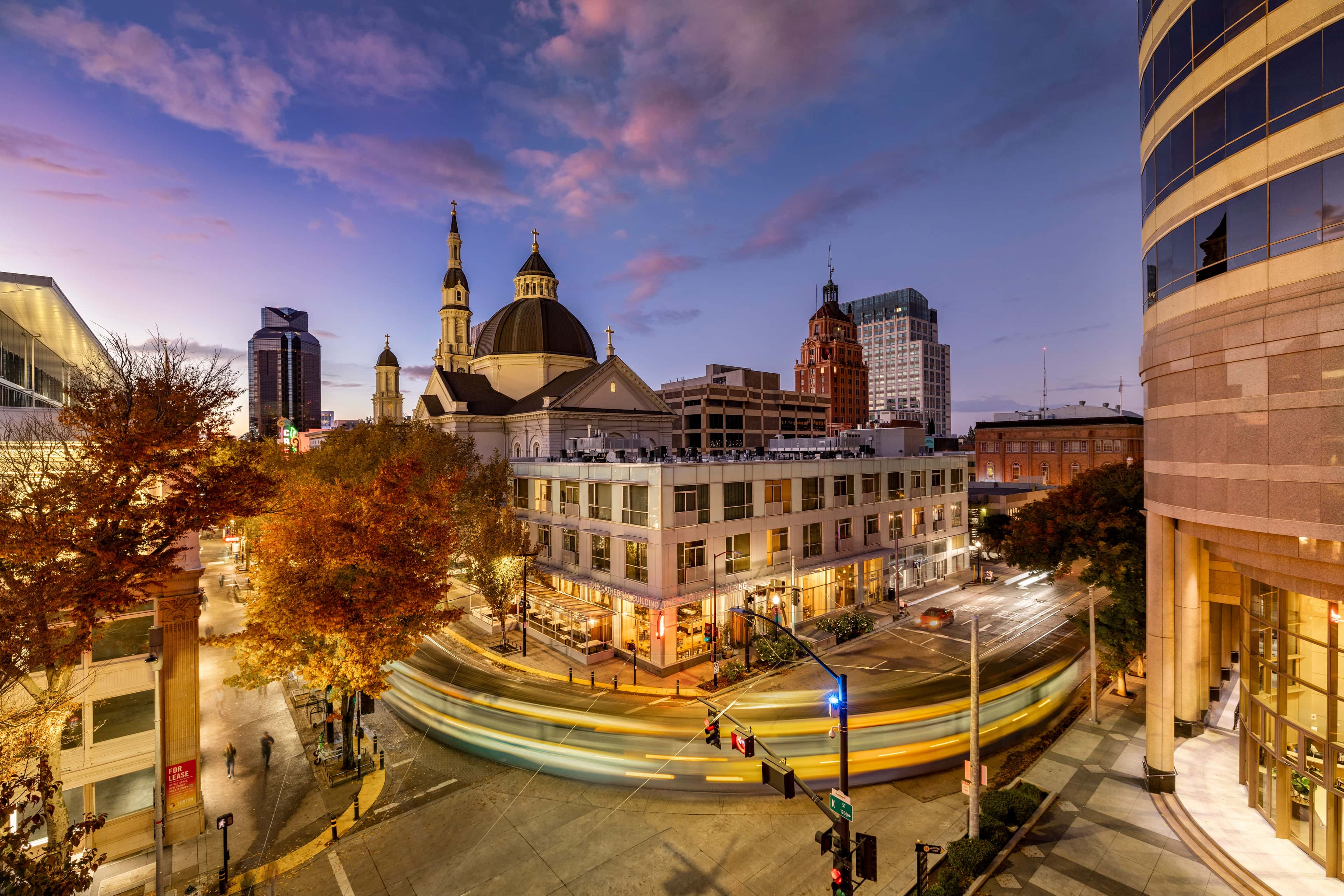 Downtown Sacramento cityscape with historic cathedral at twilight