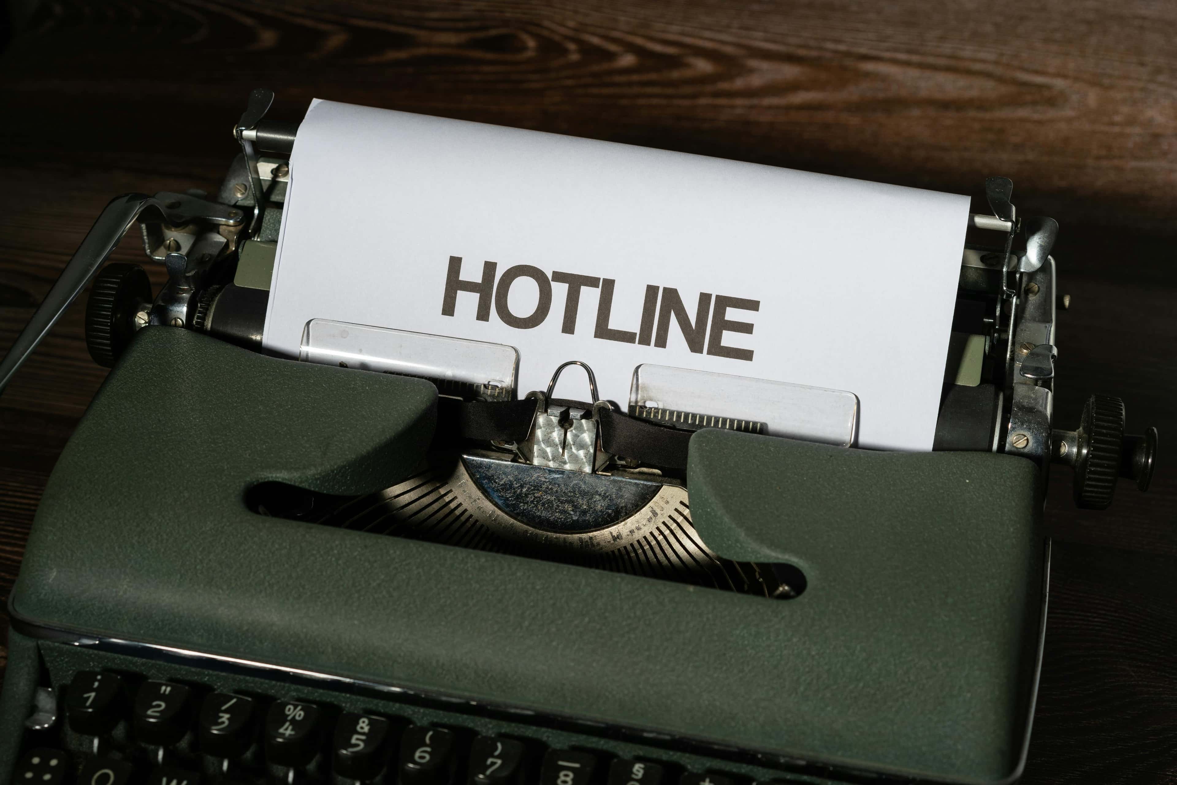 A typewriter with “hotline” written on it, representing documenting the workflow