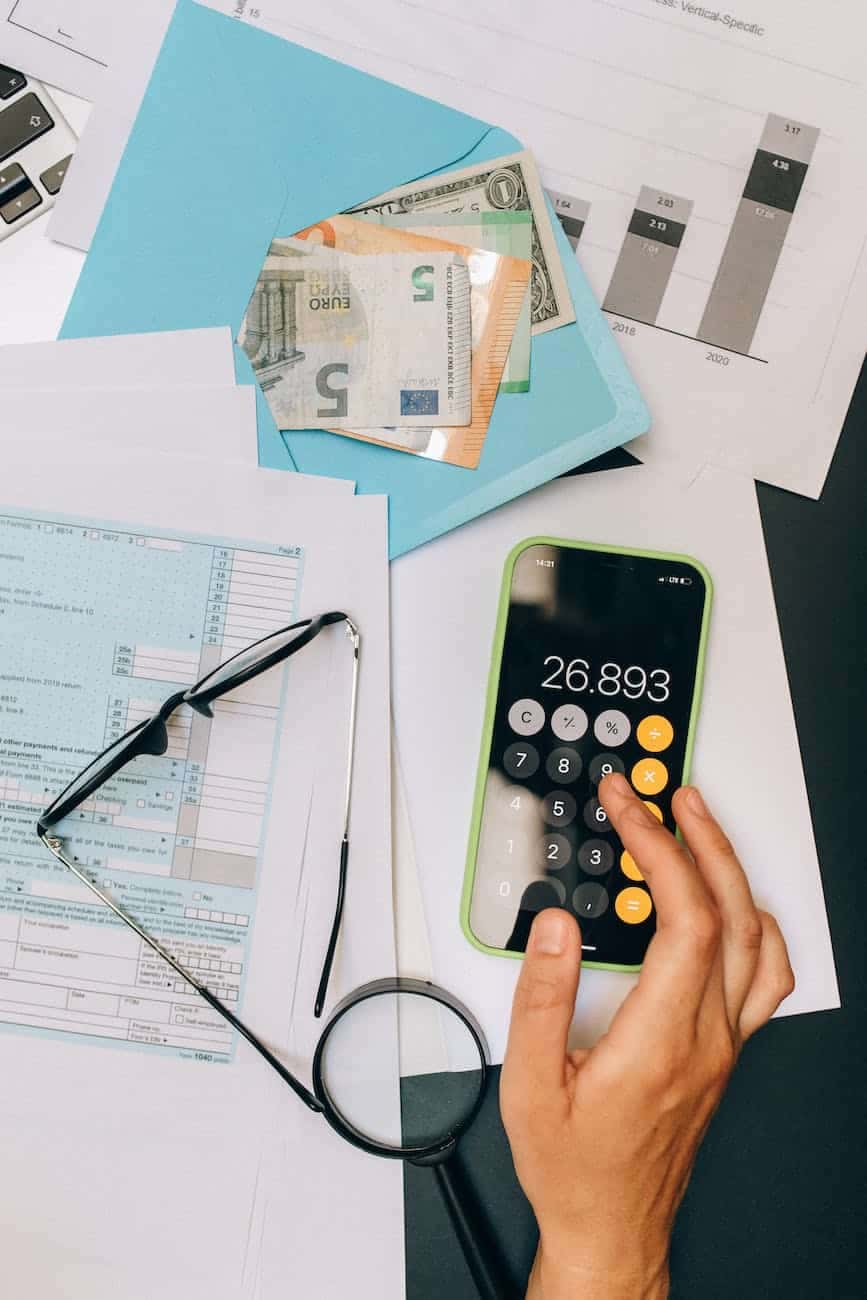 Person using a calculator for reporting and analysis