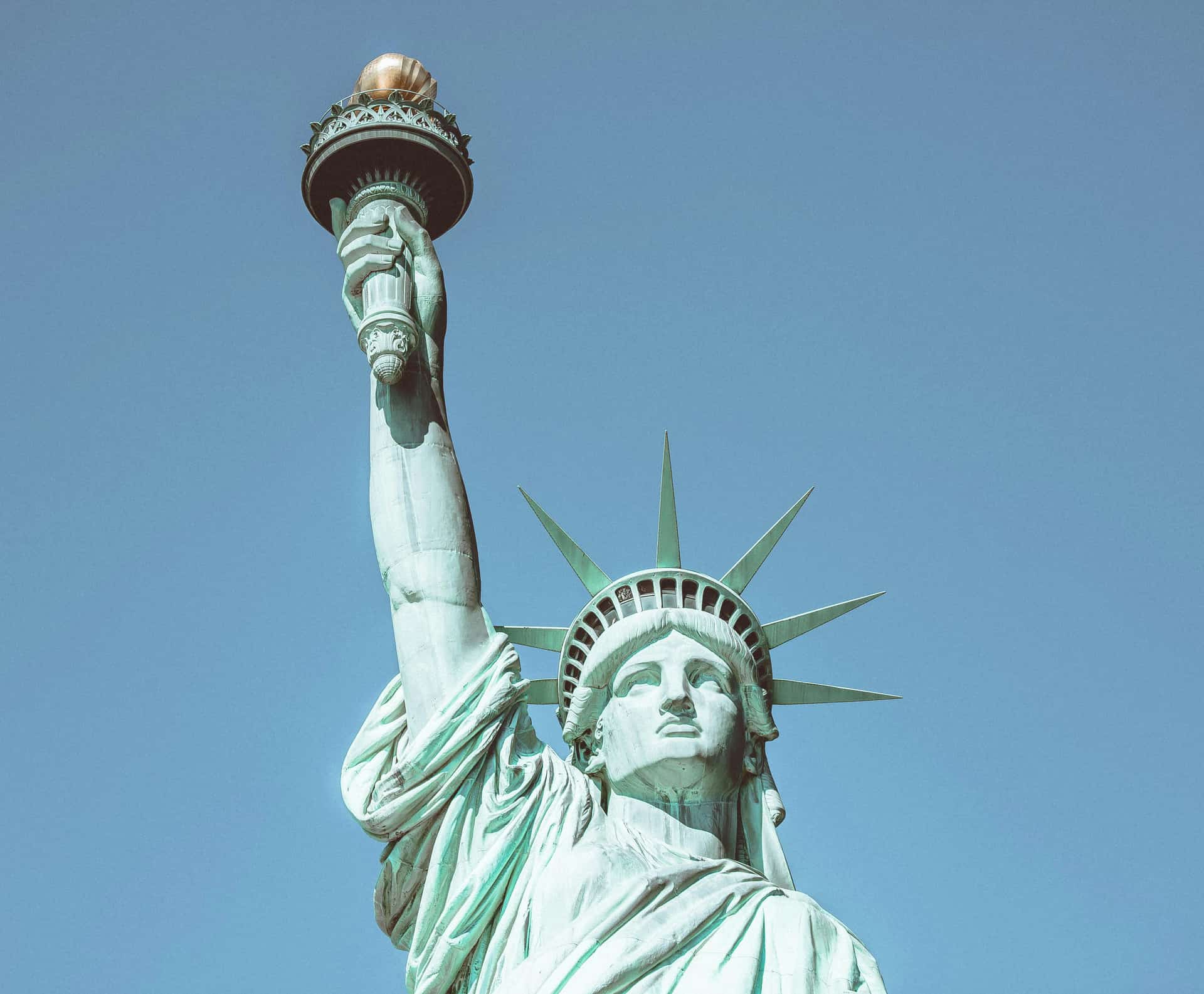 Statue of Liberty against a blue sky in New York City