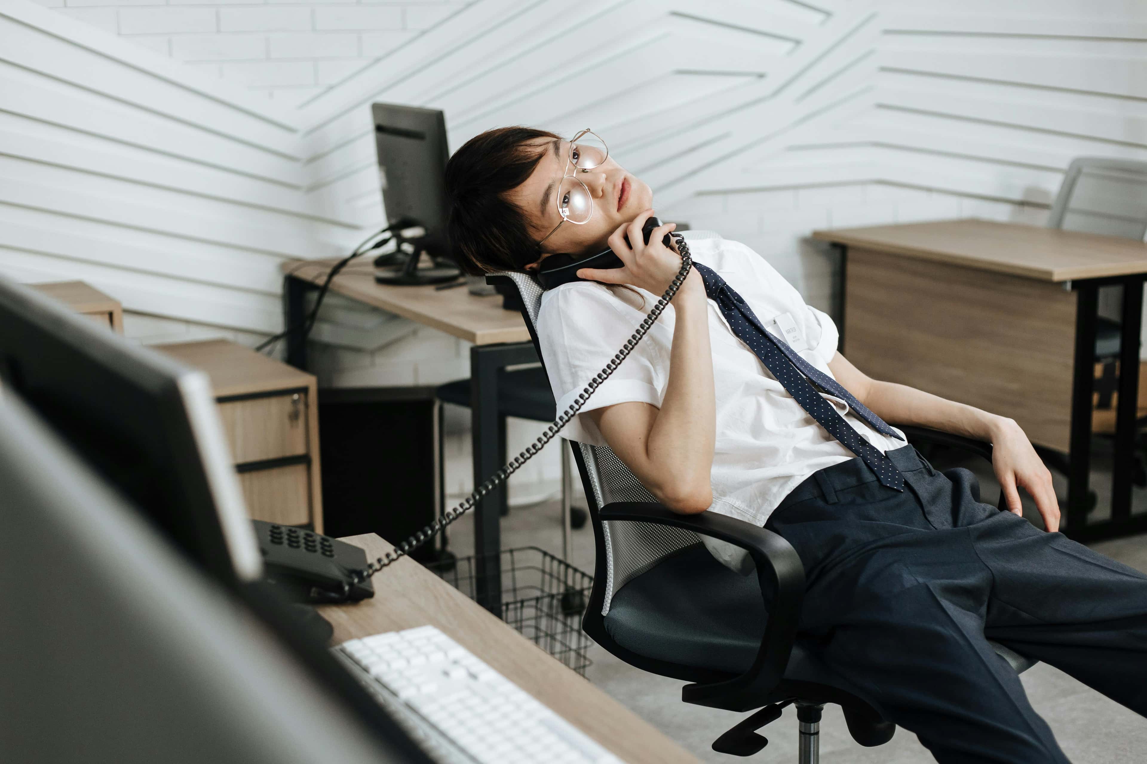 Tired call center agent at a desk