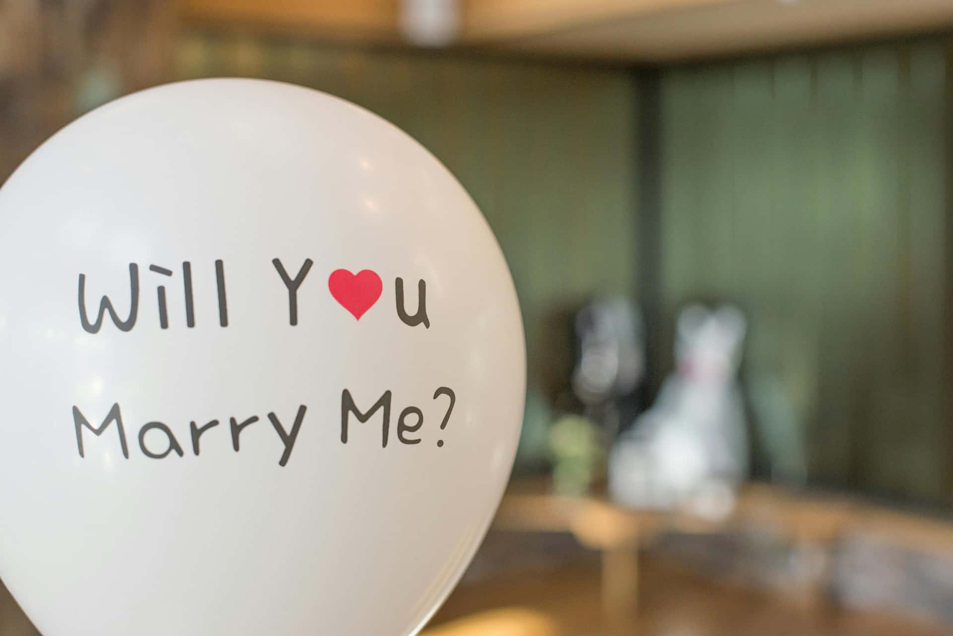 A balloon that says “Will you marry me?”, representing a simple yes/no intake question